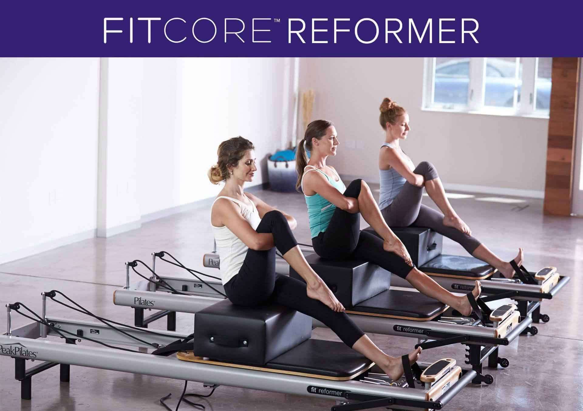 Instructors training on reformers during a FitCore certification course at CSFit Pilates