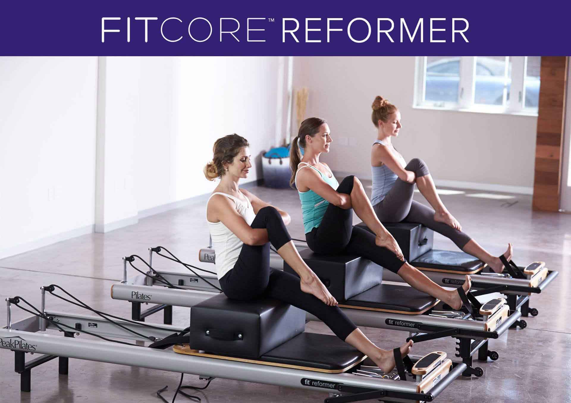 Instructors training on reformers during a FitCore certification course at CS Fit Pilates